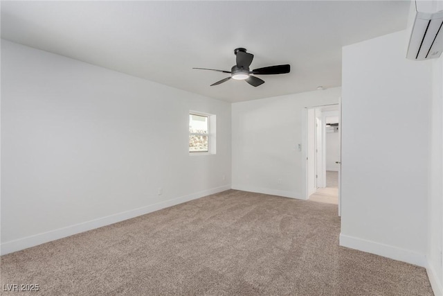 663 D Ave, Boulder City, NV 89005 - unfurnished room featuring an AC wall unit, light carpet, a ceiling fan, and baseboards