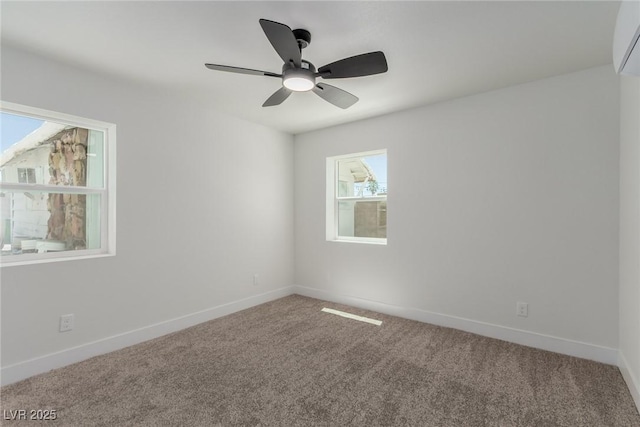 663 D Ave, Boulder City, NV 89005 - carpeted spare room featuring baseboards, an AC wall unit, and a ceiling fan