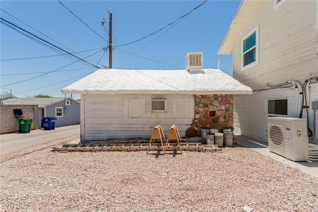 663 D Ave, Boulder City, NV 89005 - rear view of property featuring a cooling unit and stone siding