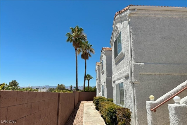 1800 Edmond St Unit 218, Las Vegas, NV 89146 - view of side of home featuring fence and stucco siding