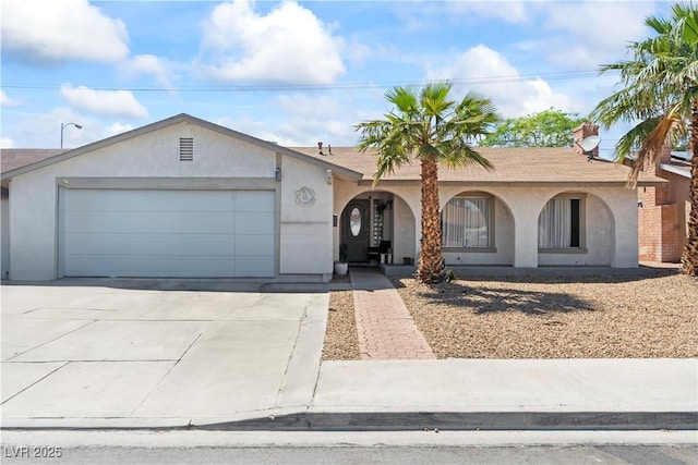 3661 Margarita Way, Las Vegas, NV 89103 - ranch-style home featuring an attached garage, concrete driveway, stucco siding, and covered porch