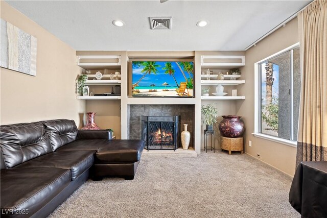 3661 Margarita Way, Las Vegas, NV 89103 - carpeted living area with a lit fireplace and recessed lighting