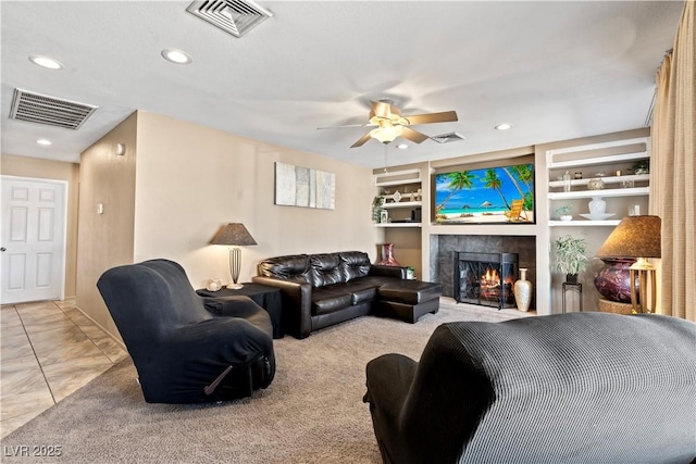 3661 Margarita Way, Las Vegas, NV 89103 - living room with a tiled fireplace, a ceiling fan, recessed lighting, and built in features