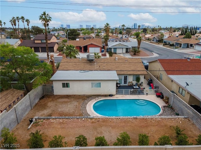 3661 Margarita Way, Las Vegas, NV 89103 - view of pool featuring a residential view, central air condition unit, and fence