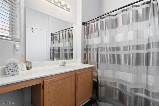 bathroom featuring vanity and a shower with shower curtain