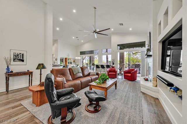 512 Pima Canyon Ct, Las Vegas, NV 89144 - living area featuring recessed lighting, wood finished floors, high vaulted ceiling, and a ceiling fan