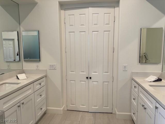 512 Pima Canyon Ct, Las Vegas, NV 89144 - bathroom with baseboards and two vanities
