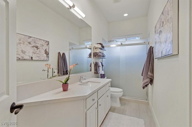 512 Pima Canyon Ct, Las Vegas, NV 89144 - bathroom featuring vanity, a shower with door, tile patterned flooring, and recessed lighting