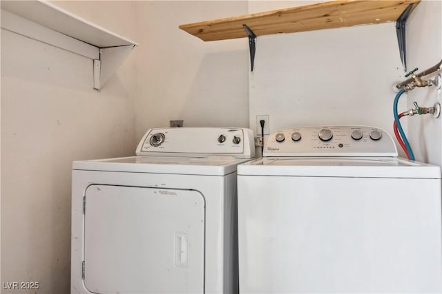 clothes washing area featuring independent washer and dryer