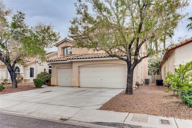 1124 Coral Rainbow Ave, Las Vegas, NV 89123 - mediterranean / spanish-style home featuring driveway, stucco siding, a tile roof, and central air condition unit