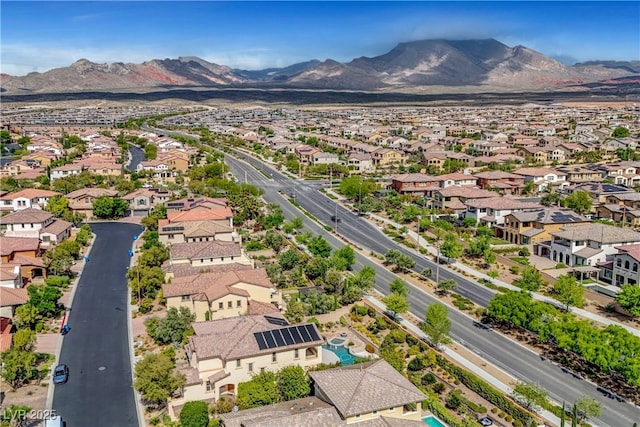 aerial view of residential area with a mountainous background