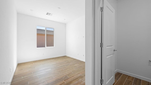 4410 E Brusca Way, Pahrump, NV 89061 - unfurnished room featuring wood finished floors and baseboards