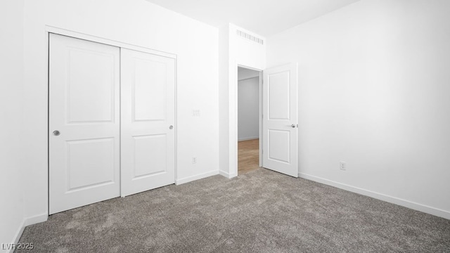 4410 E Brusca Way, Pahrump, NV 89061 - unfurnished bedroom featuring carpet, a closet, and baseboards