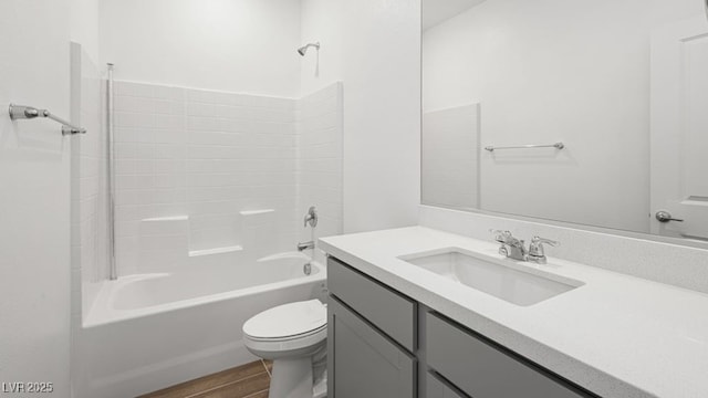 4410 E Brusca Way, Pahrump, NV 89061 - full bath with toilet, wood finished floors, vanity, and tub / shower combination