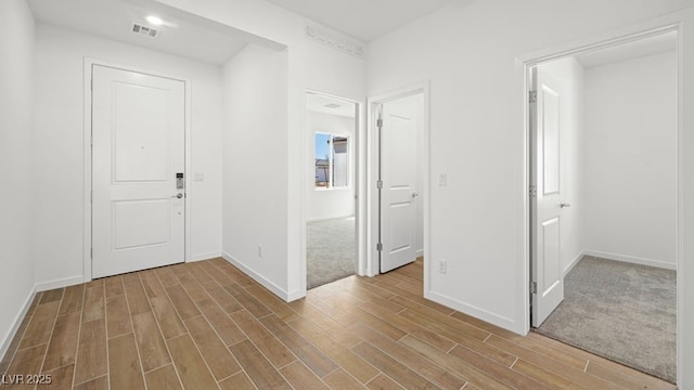 4410 E Brusca Way, Pahrump, NV 89061 - foyer entrance with wood finished floors, baseboards, and healthy amount of natural light