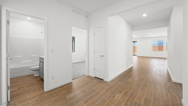 4410 E Brusca Way, Pahrump, NV 89061 - hallway featuring wood finished floors, baseboards, and recessed lighting