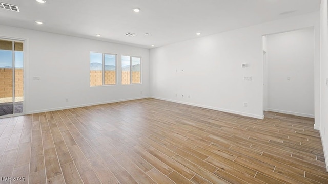 4410 E Brusca Way, Pahrump, NV 89061 - empty room with light wood-style floors, baseboards, and recessed lighting