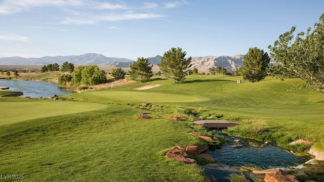 4410 E Brusca Way, Pahrump, NV 89061 - view of home's community featuring golf course view, a yard, and a water and mountain view