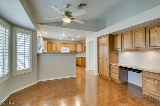 10009 Netherton Dr, Las Vegas, NV 89134 - kitchen featuring white microwave, vaulted ceiling, ceiling fan, dark wood-style floors, and recessed lighting