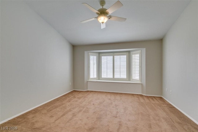 10009 Netherton Dr, Las Vegas, NV 89134 - empty room featuring light colored carpet, a ceiling fan, and baseboards