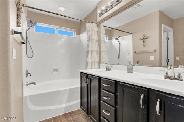 10230 Danskin Dr, Las Vegas, NV 89166 - bathroom with shower / tub combo, double vanity, and tile patterned floors