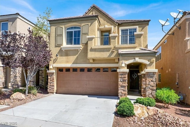10230 Danskin Dr, Las Vegas, NV 89166 - view of front of home with stucco siding, driveway, an attached garage, and stone siding