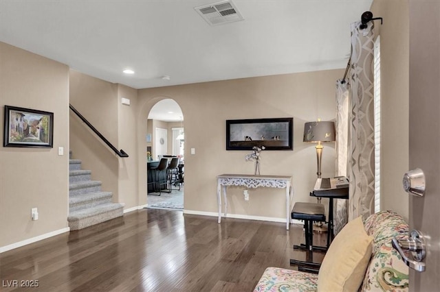10230 Danskin Dr, Las Vegas, NV 89166 - entryway featuring arched walkways, wood finished floors, baseboards, recessed lighting, and stairs