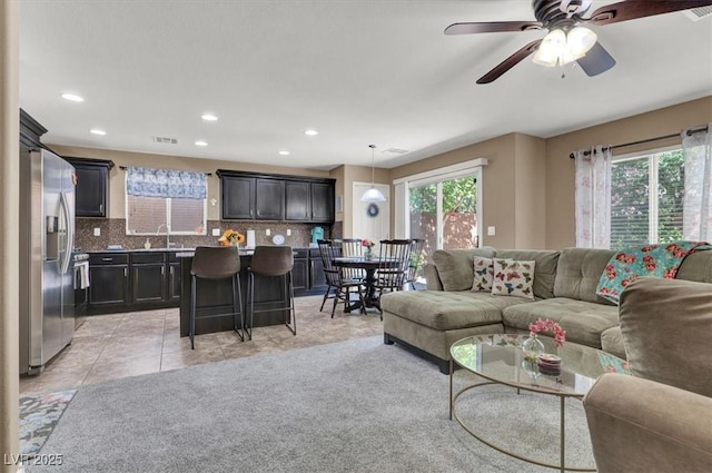 10230 Danskin Dr, Las Vegas, NV 89166 - living room with light tile patterned flooring, ceiling fan, and recessed lighting