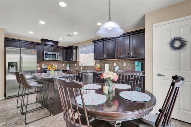 10230 Danskin Dr, Las Vegas, NV 89166 - dining room with recessed lighting and light tile patterned flooring