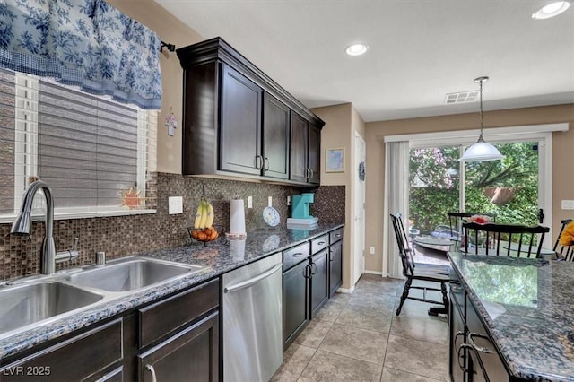 10230 Danskin Dr, Las Vegas, NV 89166 - kitchen with dishwasher, a sink, decorative backsplash, dark brown cabinets, and hanging light fixtures