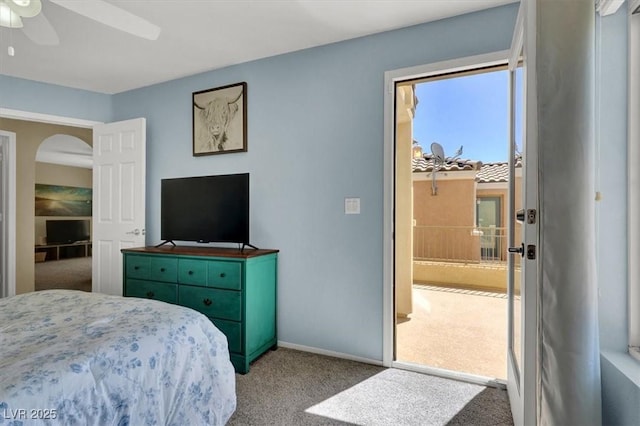 10230 Danskin Dr, Las Vegas, NV 89166 - carpeted bedroom with baseboards, a ceiling fan, and arched walkways