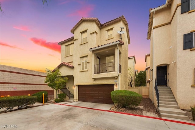 6488 Bentley Wood Ct, Las Vegas, NV 89130 - view of front of property with stucco siding, driveway, and an attached garage
