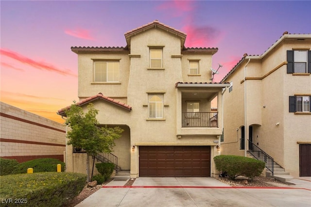 6488 Bentley Wood Ct, Las Vegas, NV 89130 - view of front facade featuring stucco siding, a garage, and a tiled roof