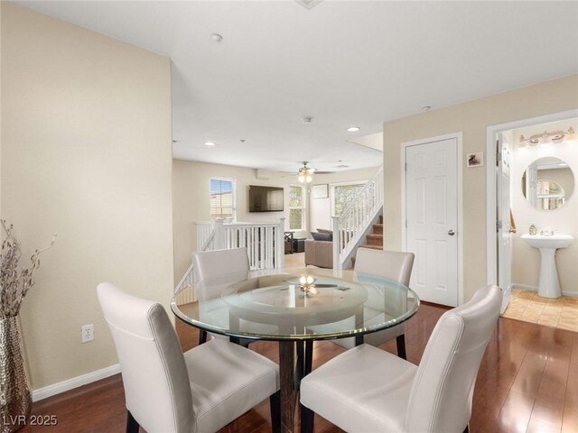 6488 Bentley Wood Ct, Las Vegas, NV 89130 - dining area with baseboards, wood finished floors, stairs, ceiling fan, and recessed lighting