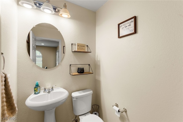 6488 Bentley Wood Ct, Las Vegas, NV 89130 - half bathroom with toilet and a sink