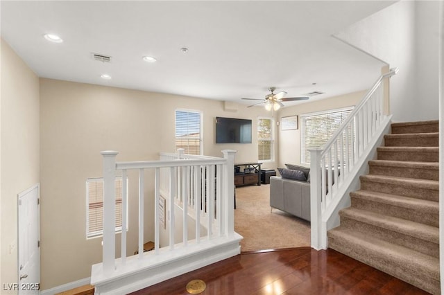 6488 Bentley Wood Ct, Las Vegas, NV 89130 - stairway with plenty of natural light, wood finished floors, ceiling fan, and recessed lighting