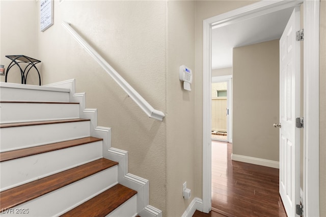 6488 Bentley Wood Ct, Las Vegas, NV 89130 - stairs with wood finished floors and baseboards