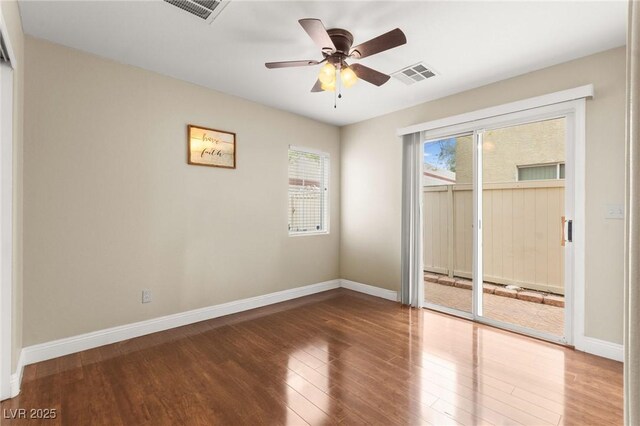 6488 Bentley Wood Ct, Las Vegas, NV 89130 - empty room with wood finished floors, baseboards, and a ceiling fan