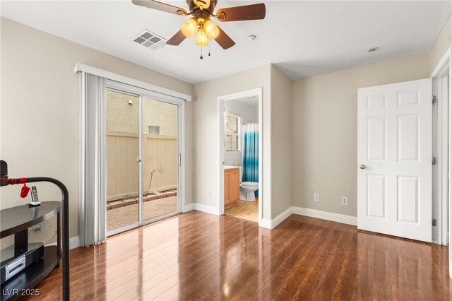 6488 Bentley Wood Ct, Las Vegas, NV 89130 - bedroom with access to exterior, baseboards, wood finished floors, and a ceiling fan