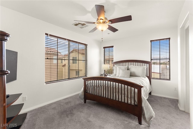 6488 Bentley Wood Ct, Las Vegas, NV 89130 - bedroom with multiple windows, carpet floors, and baseboards
