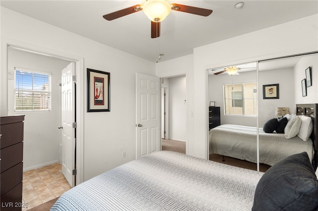 6488 Bentley Wood Ct, Las Vegas, NV 89130 - bedroom with multiple windows, a closet, and ceiling fan