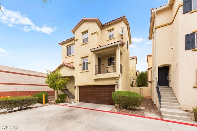 6488 Bentley Wood Ct, Las Vegas, NV 89130 - view of front of house featuring stucco siding, an attached garage, driveway, and fence