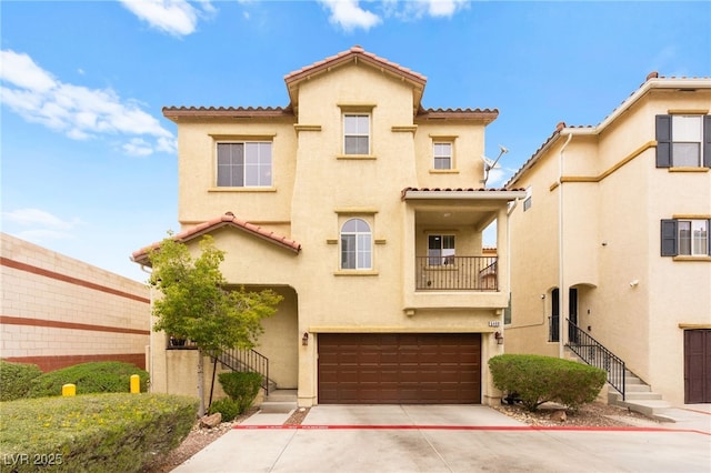6488 Bentley Wood Ct, Las Vegas, NV 89130 - view of front facade featuring stucco siding, a tiled roof, a garage, and a balcony