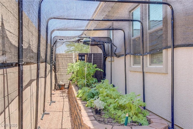 709 Corelli Cove St, Henderson, NV 89011 - view of patio with a vegetable garden
