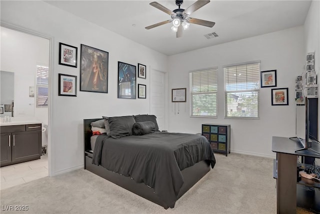 709 Corelli Cove St, Henderson, NV 89011 - bedroom featuring light colored carpet, baseboards, ensuite bath, and ceiling fan