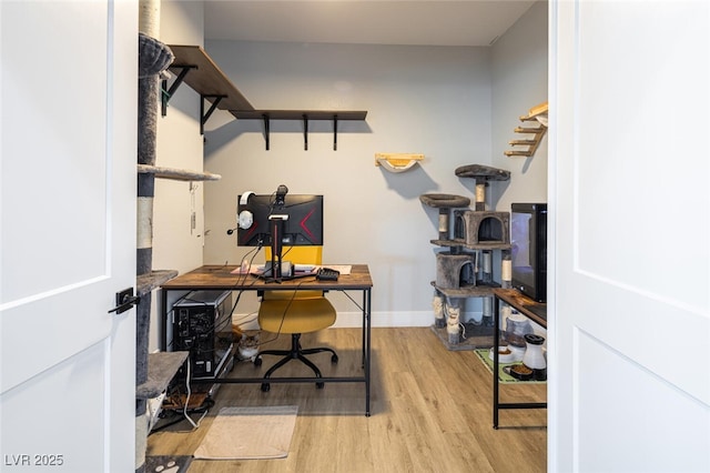 office area with wood finished floors and baseboards