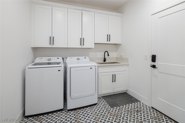 laundry room featuring washer and dryer, baseboards, cabinet space, and tile patterned floors