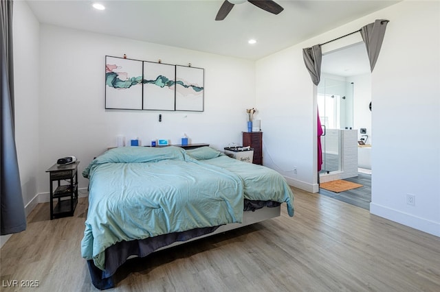 bedroom featuring light wood-type flooring, baseboards, recessed lighting, ensuite bathroom, and a ceiling fan
