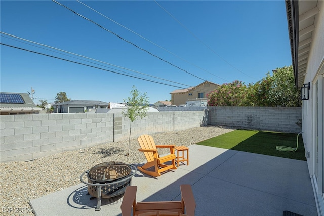 view of patio / terrace with a fire pit and a fenced backyard