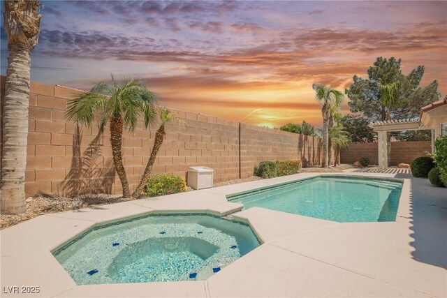 3882 Genoa Dr, Las Vegas, NV 89141 - view of pool featuring a fenced backyard and a pool with connected hot tub